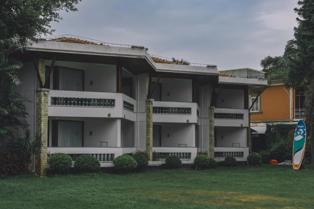 Apartment building with shared green lawn in San Diego, maintained by professional dog poop scoop service